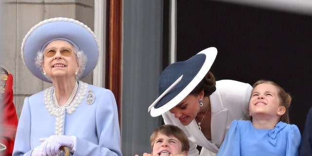 Queen Elizabeth, Prince Louis, Kate Middleton and Princess Charlotte during Trooping the Colour on June 02, 2022 in London, England.