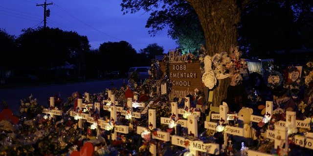 The wooden cross is placed at a monument dedicated to the victims of the shootings at Robb Elementary School on June 3, 2022 in Uvalde, Texas.  On May 24, 19 students and two teachers were killed after an 18-year-old gunner fired in the school.  Awakenings and funerals for 21 victims are scheduled throughout the week.  