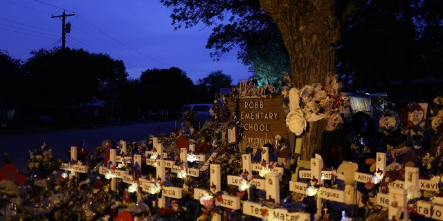 Wooden crosses are placed at a memorial dedicated to the victims of the mass shooting at Robb Elementary School on June 3, 2022 in Uvalde, Texas. 19 students and two teachers were killed on May 24 after an 18-year-old gunman opened fire inside the school. Wakes and funerals for the 21 victims are scheduled throughout the week.  