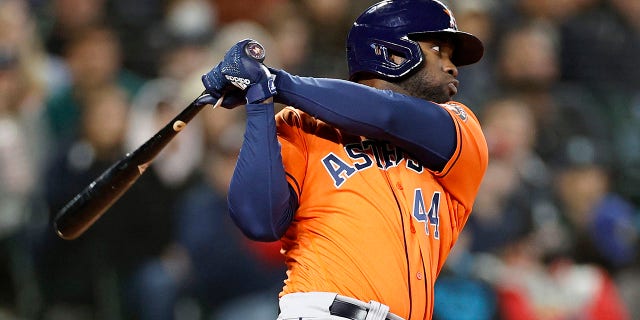 Yordan Alvarez #44 of the Houston Astros watches his single to score Aledmys Diaz #16 in the eighth inning against the Seattle Mariners at T-Mobile Park on May 29, 2022 in Seattle, Washington.