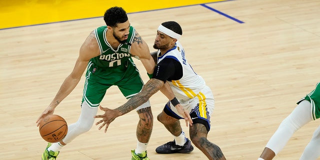 Jayson Tatum (0) of the Boston Celtics dribbles against Gary Payton II (0) of the Golden State Warriors during the second quarter in Game 2 of the 2022 NBA Finals at Chase Center June 5, 2022, in San Francisco. 