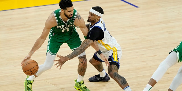 Jayson Tatum (0) of the Boston Celtics dribbles against Gary Payton II (0) of the Golden State Warriors during the second quarter in Game 2 of the 2022 NBA Finals at Chase Center June 5, 2022, in San Francisco. 