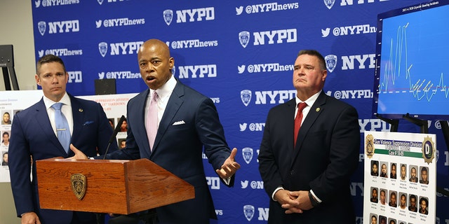 New York Mayor Eric Adams is joined by NYPD Deputy Chief Jason Savino (left) and NYPD Chief of Detectives James Essig at a Brooklyn police facility where it was announced that arrests have been made against violent street gangs. At the briefing he said criminals believe the criminal justice system is a "laughingstock" while acknowledging the gun violence has begun to decline in the past several weeks. 