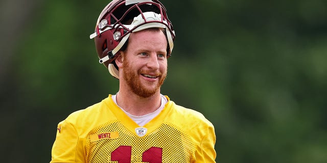 Carson Wentz of the Washington Commanders reacts during practice at INOVA Sports Performance Center June 8, 2022, in Ashburn, Va.