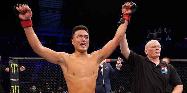 Zhang Mingyang of China reacts after his knockout over Tuco Tokkos of England during the Road to UFC event at Singapore Indoor Stadium on June 09, 2022 in Singapore. 