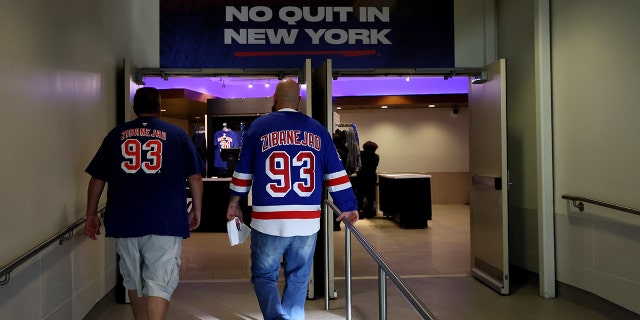 Fans arrive prior to Game 5 of the Eastern Conference finals of the 2022 Stanley Cup playoffs between the Tampa Bay Lightning and the New York Rangers at Madison Square Garden June 9, 2022, in New York City. 