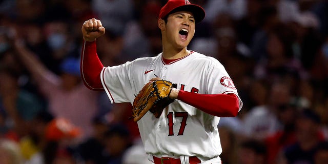 Shohei Ohtani of the Los Angeles Angels celebrates scoring the third out in the sixth inning against the Boston Red Sox at Angel Stadium of Anaheim on June 9, 2022 in Anaheim, California.