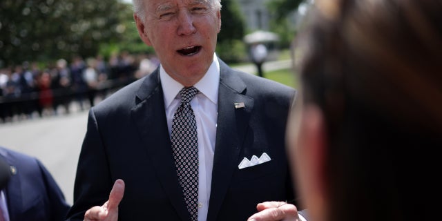 President Joe Biden speaks to members of the press