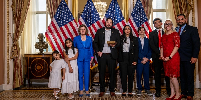 Washington DC-June 21: Parliamentarian-elect Myra Flores (R-TX) joins her family and Speaker of the House Nancy Pelosi (D-CA) after sworn in Washington DC on June 21, 2022. Standing  ..  (Photo by Brandon Bell / Getty Images)