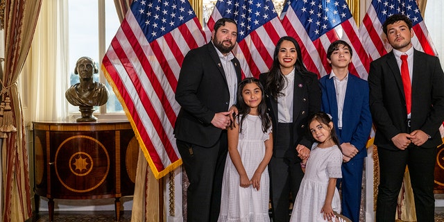 Congresswoman-elect Mayra Flores, R-Texas stands with her family for a portrait after being sworn-in by Speaker of the House Nancy Pelosi, D-Calif., on June 21, 2022 in Washington, D.C. 