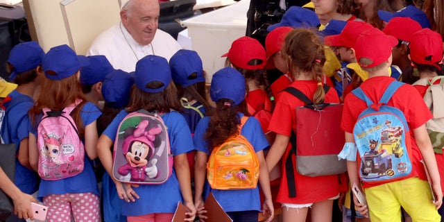 Pope Francis greets a group of children at the end of his general weekly audience in St. Peter's Square on June 22, 2022 in Vatican City, Vatican. (Photo by Franco Origlia/Getty Images)