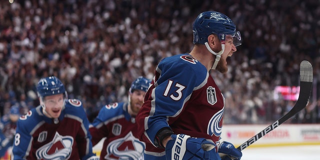 Valeri Nichushkin (13) of the Colorado Avalanche celebrates a goal by Cale Makar (8) of the Colorado Avalanche during the third period in Game 5 of the 2022 NHL Stanley Cup Final against the Tampa Bay Lightning at Ball Arena June 24, 2022, in Denver. 