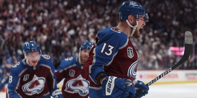 Valeri Nichushkin (13) of the Colorado Avalanche celebrates a goal by Cale Makar (8) of the Colorado Avalanche during the third period in Game 5 of the 2022 NHL Stanley Cup Final against the Tampa Bay Lightning at Ball Arena June 24, 2022, in Denver. 