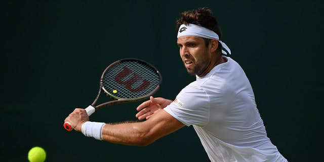Jiri Vesely of Czech Republic plays a forehand against Alejandro Davidovich Fokina of Spain during their Men's Singles Second Round match on day three of The Championships Wimbledon 2022 at All England Lawn Tennis and Croquet Club on June 29, 2022 in London, England. 