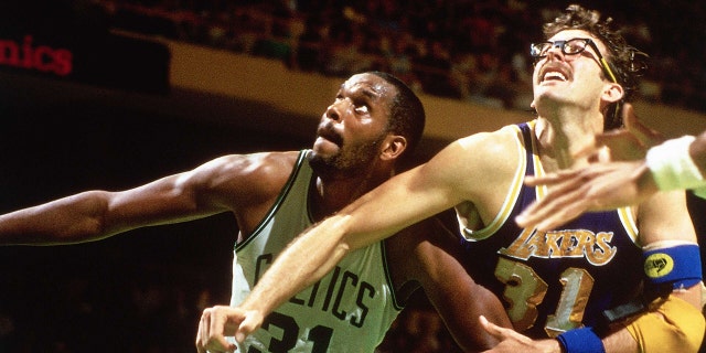 Cedric Maxwell #31 of the Boston Celtics battles for position against Kurt Rambis #31 of the Los Angeles Lakers during the 1984 season NBA game at the Boston Garden in Boston, Masachussetts.