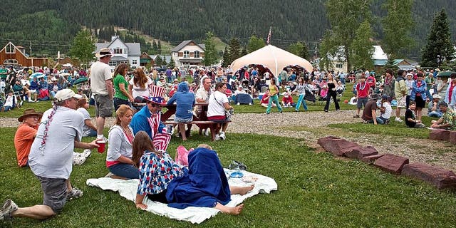 Families picnic and relax in a park in Silverton, Colorado on July 4, circa 2010.