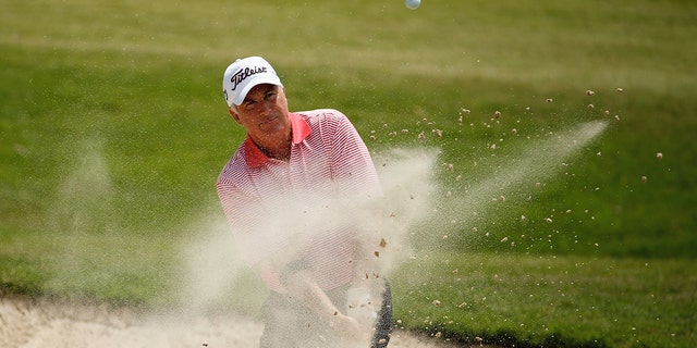 Curtis Strange hits a bunker shot on the first hole during the first round of the Insperity Invitational at the Tournament Course at the Woodlands Country Club May 2, 2014, in The Woodlands, Texas. 