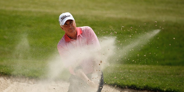 Curtis Strange hits a bunker shot on the first hole during the first round of the Insperity Invitational at the Tournament Course at the Woodlands Country Club May 2, 2014, in The Woodlands, Texas. 