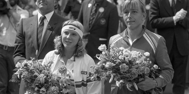 Americans Andrea Jaeger and Martina Navratilova hold bouquets after their Women's Singles Final at Wimbledon, London. Navratilova (R) won the title in straight sets: 6-0, 6-3.