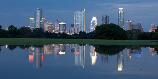 The Austin skyline is reflected in downtown's Zilker Park. 