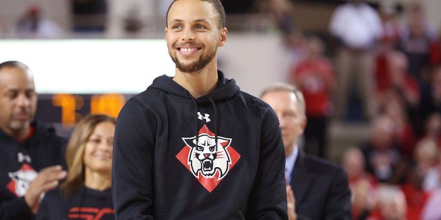 Stephen Curry #30 of the Golden State Warriors smiles on the court during the ceremony to name the student section after him at Davidson's John M. Belk Area after him at Davidson College on January 24, 2017, in Davidson, North Carolina.