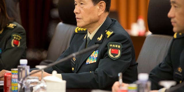 China's Defense Minister Wei Fenghe (C) talks with US Defense Secretary Jim Mattis (not pictured) during their meeting at the Bayi building in Beijing on June 27, 2018.