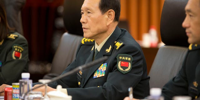 China's Defense Minister Wei Fenghe (C) talks with US Defense Secretary Jim Mattis (not pictured) during their meeting at the Bayi building in Beijing on June 27, 2018.