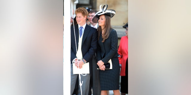 Prince Harry and Prince William's girlfriend Kate Middleton watch the Order of the Garter procession at Windsor Castle on June 16, 2008, in Windsor, England.