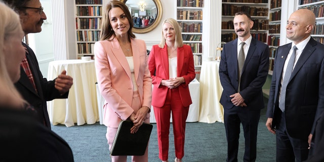Catherine, Duchess Of Cambridge, speaks with Dr. Alain Gregoire (second left), Chief Executive of Ipsos Kelly Beaver, center, Secretary of State for Health and Social Care Sajid Javid, right, and other government ministers and the early childhood sector as she hosts a roundtable to mark the release of new research from the Royal Foundation Centre for Early Childhood June 16, 2022, in London.