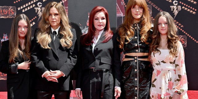 (LR) Harper Vivienne Ann Lockwood (Lisa Marie's daughter), Lisa Marie Presley, Priscilla Presley (Lisa Marie's mother), Riley Keough (Lisa Marie's daughter) and Finley Aaron Love Lockwood (Lisa Marie's daughter) attend the Handprint Ceremony honoring Three Generations of Presley's at TCL Chinese Theater June 21, 2022, in Hollywood. 