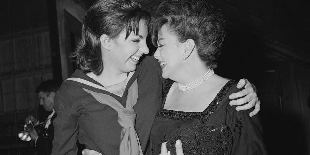 American actress and singer Liza Minnelli with her mother, American actress and singer Judy Garland (1922-1969), backstage after she opened in "Flora the Red Menace" at the Alvin Theatre, New York, circa 1965.