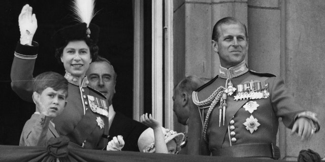 Queen Elizabeth II, the Duke of Edinburgh, Prince Charles and Princess Anne on the balcony at Buckingham Palace.