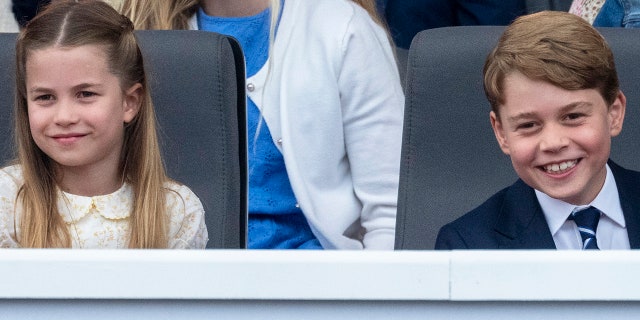 Prince George of Cambridge and Princess Charlotte of Cambridge attend the Platinum Pageant on The Mall on June 5, 2022, in London, England. 