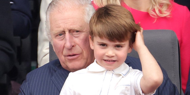 Prince Louis ran over to his grandfather Prince Charles and happily sat on his lap during the Platinum Pageant.
