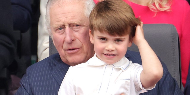 Prince Louis ran over to his grandfather Prince Charles and happily sat on his lap during the Platinum Pageant.