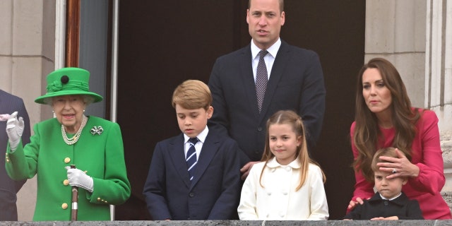 Queen Elizabeth II, Prince George, Prince William, Princess Charlotte, Catherine, Duchess of Cambridge and Prince Louis of on the balcony during the Jubilee Pageant on June 5, 2022, in London.