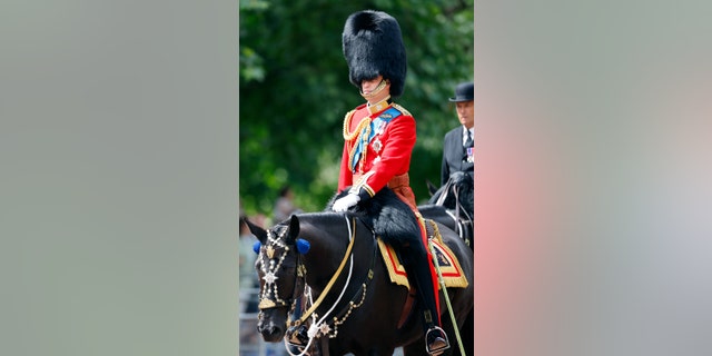 Prince William, Duke of Cambridge (in his role as Colonel of the Irish Guards) rides, on horseback, down The Mall to carry out the Colonel's Review at Horse Guards Parade May 28, 2022, in London.