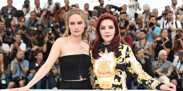 Olivia DeJonge and Priscilla Presley attend the photo call for "Elvis" during the 75th annual Cannes Film Festival at Palais des Festivals May 26, 2022, in Cannes, France. 