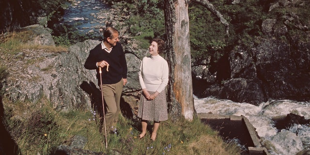 Queen Elizabeth II and Prince Philip, the Duke of Edinburgh, walking on their Balmoral Estate in Scotland, where they found peace as a couple.