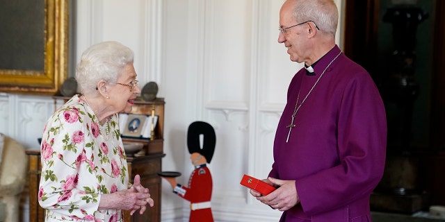 Queen Elizabeth II receives the Archbishop of Canterbury Justin Welby at Windsor Castle, where he presented her with a special 'Canterbury Cross' for her 'unstinting' service to the Church of England over 70 years and a citation for the Cross, which was presented as a framed piece of calligraphy on June 21, 2022, in Windsor, England.