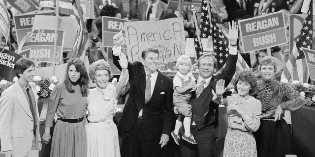 GOP presidential candidate Ronald Reagan and his family join in the jubilation at the Republican National Convention following Reagan's acceptance speech on 7/17. Left to right: Reagan's son and daughter, Ronald and Patti; wife Nancy Reagan; son Michael with grandson Cameron and daughter-in-law, Colleen; and daughter Maureen.