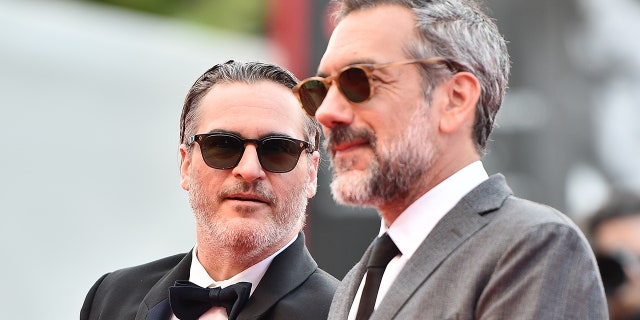 Director Todd Phillips and Joaquin Phoenix of ‘The Joker’ walk the red carpet ahead of the closing ceremony of the 76th Venice Film Festival at Sala Grande on Sept. 7, 2019, in Venice, Italy.