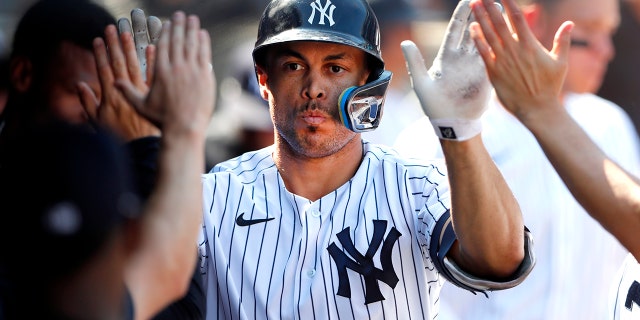 New York Yankees designated hitter Giancarlo Stanton celebrates after hitting a home run against the Houston Astros during the seventh inning of a baseball game, Sunday, June 26, 2022, in New York.