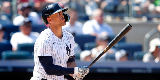 New York Yankees designated hitter Giancarlo Stanton watches his home run ball against the Houston Astros during the seventh inning of a baseball game, Sunday, June 26, 2022, in New York.