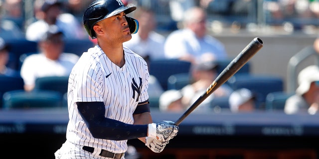 New York Yankees designated hitter Giancarlo Stanton watches his home run ball against the Houston Astros during the seventh inning of a baseball game, Sunday, June 26, 2022, in New York.