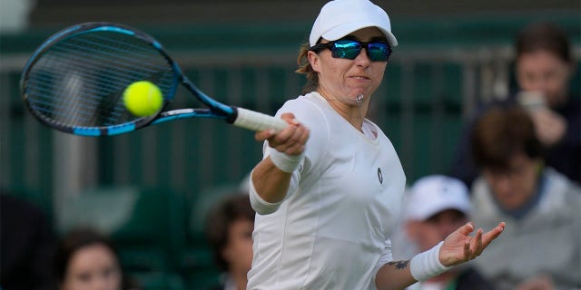 Mexico's Fernanda Contreras Gomez returns the ball to Poland's Magda Linette during their women's singles match on day one of the Wimbledon tennis championships in London, Monday, June 27, 2022.