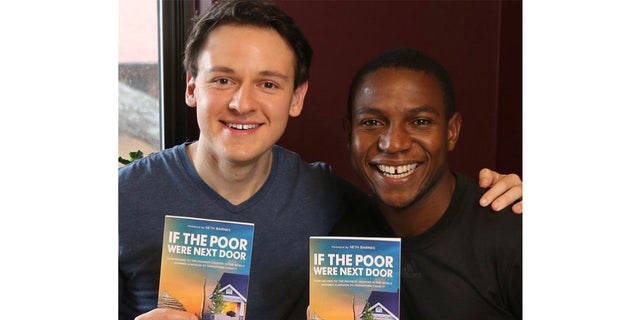 Murdered non-profit founder Gret Glyer posing with a book he wrote about ending poverty.