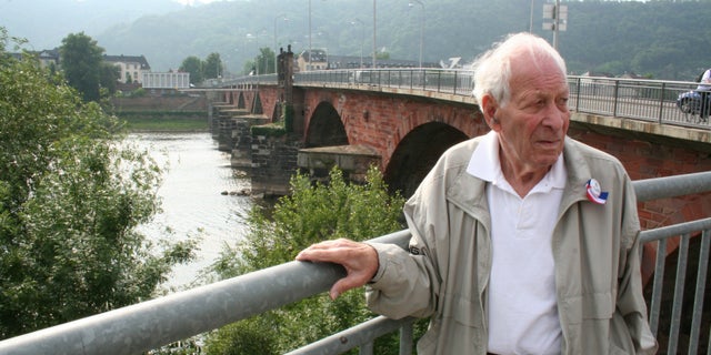 Whisler in 2010 revisiting the Roman Bridge in Trier, Germany, where he met Patton.