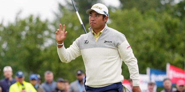 Hideki Matsuyama of Japan will react after putting the 7th hole in the final round of the US Open Golf Tournament at the Country Club in Brookline, Massachusetts on Sunday, June 19, 2022.
