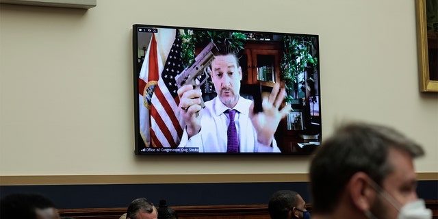 Rep. Greg Steube, R-Fla., demonstrates assembling his handgun as he speaks remotely during a House Judiciary Committee mark up hearing in the Rayburn House Office Building on June 2, 2022 in Washington.